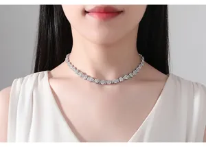 Detailed close-up view of an elegant silver flower choker necklace set with sparkling zircons.