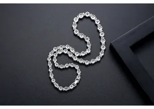 Detailed macro shot of a flower-shaped necklace with sparkling zircon stones