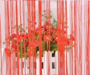 Detailed close-up of a red Korean style string curtain partition for home interior