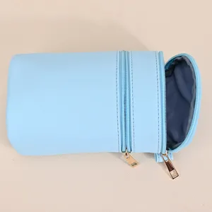 Light blue PU leather cylindrical phone crossbody bag with double gold-toned zippers