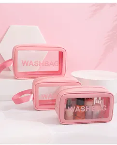 Detail of pink waterproof travel toiletry bags with transparent PVC windows