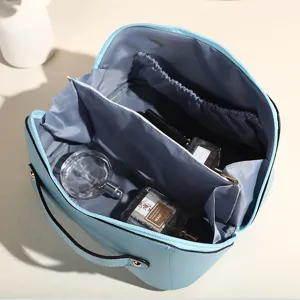 Neceser de viaje de PU azul claro de gran capacidad con divisores internos y compartimentos