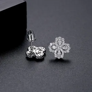 Elegant silver four-petal flower stud earrings with sparkling cubic zirconia stones
