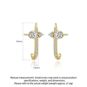 Elegant gold copper hook earrings with sparkling zirconia in a minimalist cross design