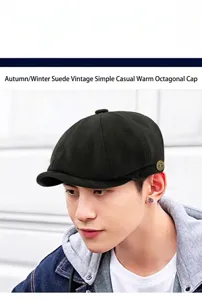 Stylish side view of a young man wearing a black suede vintage newsboy octagonal hat.