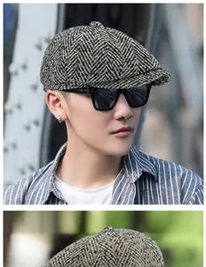 Male model wearing a vintage grey herringbone newsboy cap in an outdoor urban setting