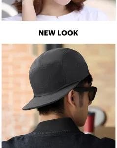 Side view detail of a black five-panel flat-brim baseball cap worn by a male model