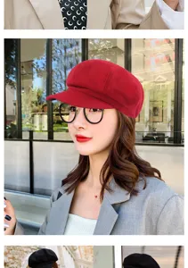 Detailed view of a stylish red wool newsboy hat worn by a female model in an urban setting