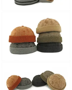 Close-up view of distressed ribbed knit Miki hats in various colors including orange and grey
