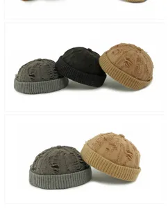 Close-up showing the ripped texture and ribbed roll edge of these retro knit beanies.