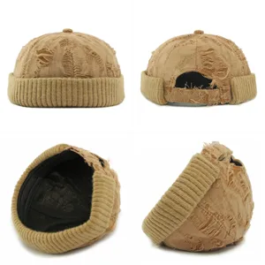 Distressed khaki docker hat with ripped fabric and ribbed knit rolled brim for men and women