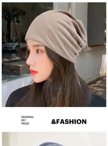 Stylish khaki textured knit slouchy beanie hat for men and women in outdoor street setting
