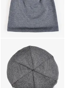 Close-up of gray cotton knit slouchy beanie showing textured weave and crown stitch in detail
