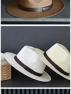 Primo piano di un cappello di paglia Panama con fascia in pelle e logo LHASA.