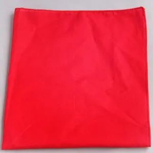 Detail macro view showing the texture and vibrant red color of a hip-hop dancer bandana.