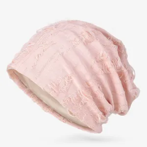 Stylish light pink distressed slouchy beanie with breathable stripe texture and ripped design