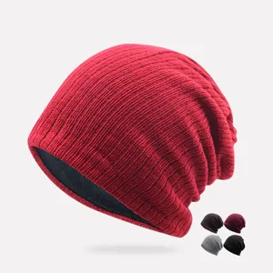 Slouchy acrylic knitted beanie in red color with multi-color variants for streetwear