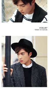Classic black wool felt fedora hat with wide brim worn by a model in an urban setting