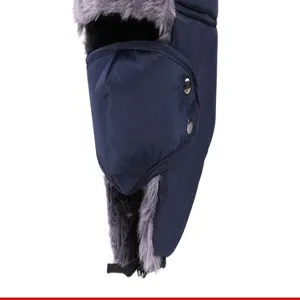 Close-up of navy blue winter trapper hat with warm gray faux fur lining and metal buttons