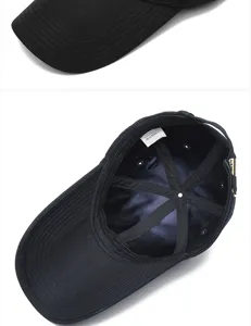 Interior and close-up detail of black cotton baseball cap with extended brim