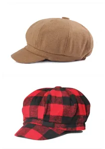 Detail of retro wool newsboy hats in solid brown and red black plaid patterns.