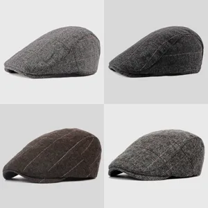 Four styles of men's vintage herringbone tweed beret flat caps for autumn and winter