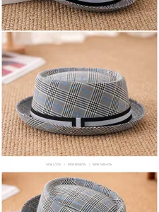 Detail view of British retro checkered trilby hat with stylish stripe band detail