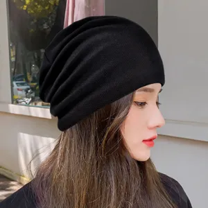 Black cotton knit slouchy beanie for casual outdoor wear and street style.