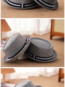 Detailed view of grey plaid trilby hats with elegant ribbon band and vintage British style.