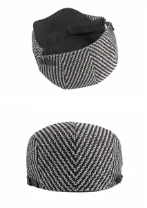Detailed view of the black and white knitted texture on this classic newsboy cap