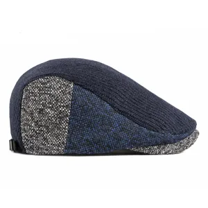 Classic knitted wool flat cap in navy blue and grey color-block for autumn and winter.