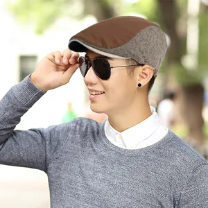 Vintage British style newsboy cap for men featuring a brown and grey patchwork design