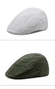 Classic cotton flat caps in white and olive green showing texture and stitching details