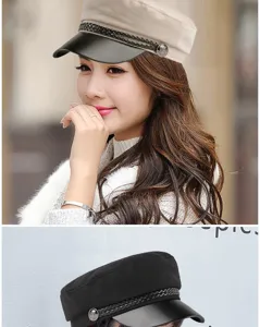 Detail of chic flat top baker boy cap with leather brim and braided rope decoration