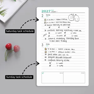 Gros plan sur la page de l'agenda A5 2027 avec les programmes du samedi et dimanche