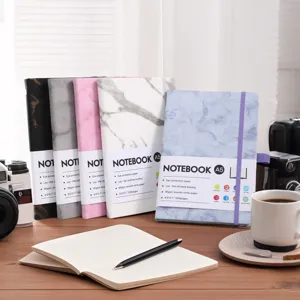 Detail of A5 marble patterned notebooks with elastic straps and product specifications