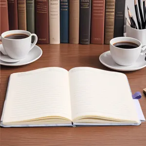 Detailed macro view of open A5 marble notebook showing lined paper and purple strap