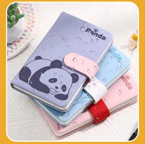 Close-up of three cute panda-themed waterproof journals with colorful magnetic buckle