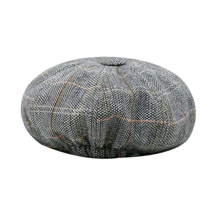 Vintage grey herringbone newsboy cap for men with colorful grid lines on white background
