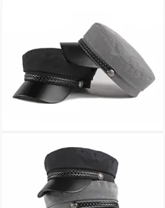 Detail view showing black and grey military-style fiddler caps with braided trim.