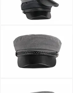 Front view detail of a grey flat top cap with black leather brim and braided cord