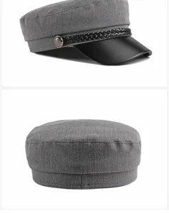Grey flat-top military newsboy cap with braided rope and black short brim detail.