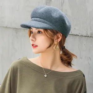 Minimalist gray wool baker boy hat for women featuring curved brim for autumn winter.