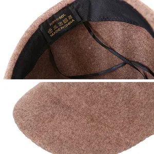 Detailed view of autumn winter 100% wool newsboy cap beret for women with fabric texture