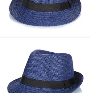 Macro detail of blue woven straw fedora hat with elegant black ribbon band for summer