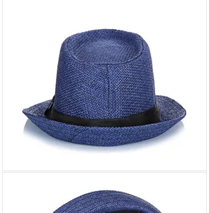 Detail view of the breathable woven texture on a blue straw fedora hat.