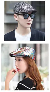 Close-up of stylish floral embroidered and tiger print beret caps worn by models outdoors