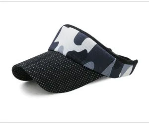 Detailed view of the camouflage and polka dot fabric on this outdoor sport visor sun hat