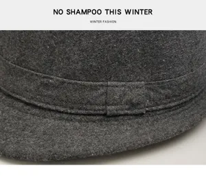 Close-up detail showing the premium texture and stitching of dark grey wool felt fedora hat