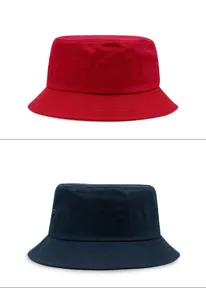 Detailed view of red and navy blue oversized canvas bucket hats for outdoor sun protection